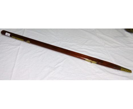 The Inns of Court Regiment, a WWI period mahogany and brass pacing stick, 36"