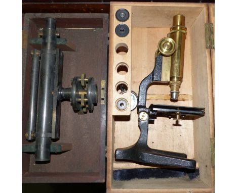 A surveyor's level, cased; a microscope; another item (a.f.)