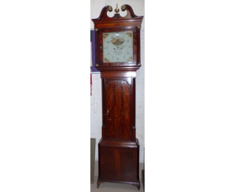 A late 18th century figured mahogany longcase clock with Sheraton style inlay, swan neck pediment and turned pillars to hood,