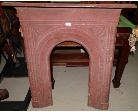 A Victorian cast iron fire surround