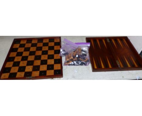 A 19th century travelling chess set with turned boxwood and ebony chessmen, and mahogany folding board; a 19th century foldin