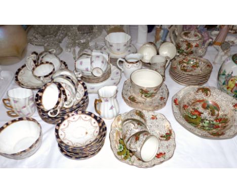 A Japan bordered part tea service; a rose pattern part tea set; a 1930's "Phoenix" tea set