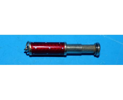 A yellow metal bridge pencil/fob with red enamel decoration, unmarked, tests as 9 ct, 7.7 gm gross