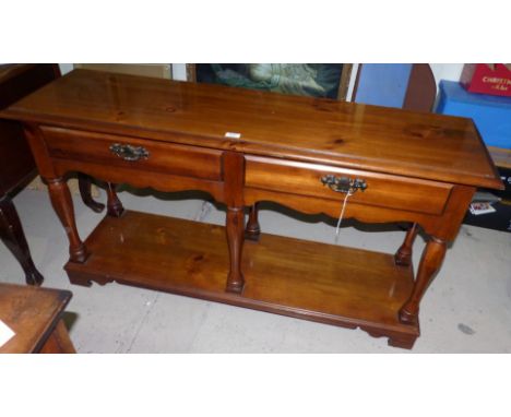 A period style stained wood sideboard with 2 drawers and shelf under