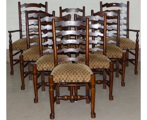 A set of 8 (6 +2) distressed oak ladder back dining chairs, on club legs, the seats in overstuffed patterned fabric