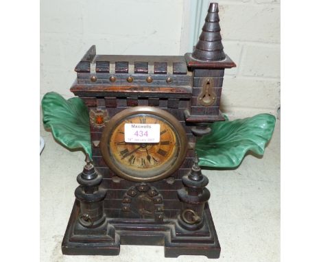 A 19th novelty mantel clock in carved case depicting a castle with turret, height 12"; a green pottery leaf dish