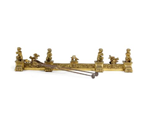 A FRENCH ORMOLU FENDER IN LOUIS XVI STYLE, 19TH CENTURY with cherubic faun figures playing music, interspersed with war troph