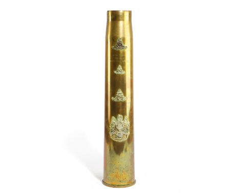 A BRASS TRENCH ART ARTILLERY SHELL STICKSTAND DATED '1942' applied with four Royal Artillery crests, including one surmounted