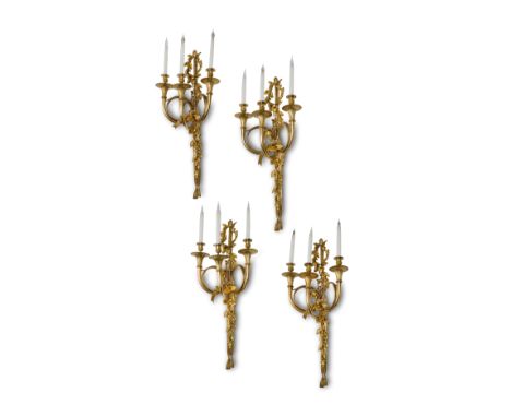 A RARE SET OF FOUR FRENCH ORMOLU 'AUX CORS DE CHASSE' WALL LIGHTS IN LOUIS XVI STYLE AFTER A MODEL BY EDME-JEAN GALLIEN AND P