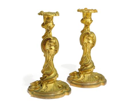 A PAIR OF FRENCH ORMOLU CANDLESTICKS IN LOUIS XV STYLE AFTER A DESIGN BY JUSTE-AURELE MEISSONNIER (FRENCH 1695-1750) the deta