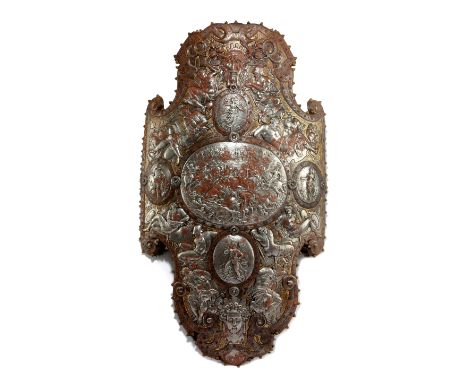 AN EMBOSSED STEEL PARADE SHIELD IN THE STYLE OF ELISEUS LIBAERTS OF ANTWERP, 19TH CENTURY of cartouche form, with a central o