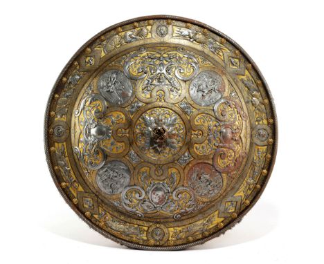 A FINE ITALIAN EMBOSSED AND GILDED STEEL PARADE SHIELD IN MILANESE RENAISSANCE STYLE, 19TH CENTURY of convex circular form, w