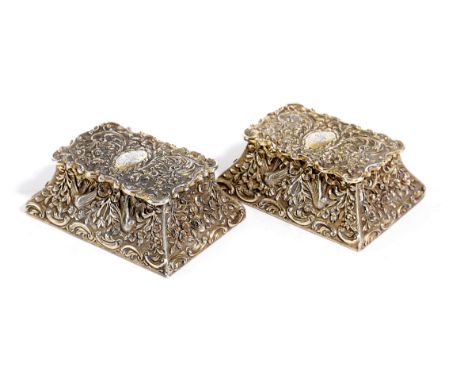 A PAIR OF EDWARDIAN SILVER-GILT DOUBLE STAMP BOXES BY J BATSON &amp; SON, LONDON 1901 of tapering rectangular form, heavily c