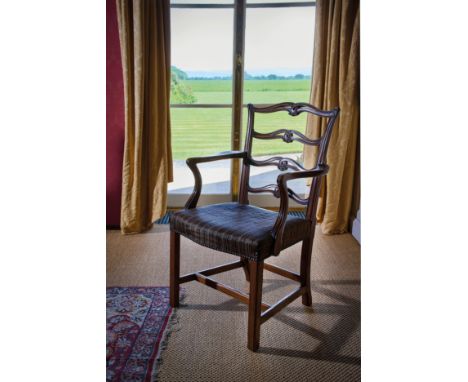 A SET OF FOURTEEN MAHOGANY DINING CHAIRS IN GEORGE III STYLE, 20TH CENTURY each with a pierced and scroll ladder back, above 