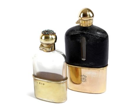 A LATE VICTORIAN GEM SET SILVER-GILT HIP FLASK BY CHARLES AND GEORGE ASPREY, LONDON, 1895 of rounded rectangular form, with a