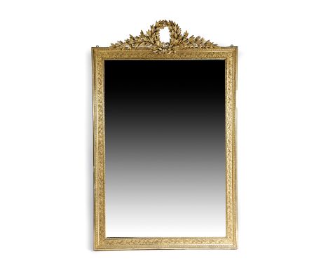 A FRENCH GILTWOOD AND GESSO OVERMANTEL MIRROR IN LOUIS XVI STYLE, 19TH CENTURY the rectangular bevelled plate within a laurel