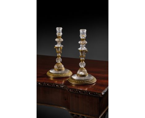 'THE BARON LIONEL DE ROTHSCHILD ROCK CRYSTAL CANDLESTICKS' A RARE PAIR OF FRENCH LOUIS XVI ROCK CRYSTAL AND ORMOLU CANDLESTIC