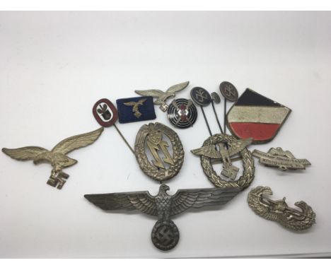 A collection of German Third Reich enamel stick pins and badges including Hitler Youth Proficiency badges,