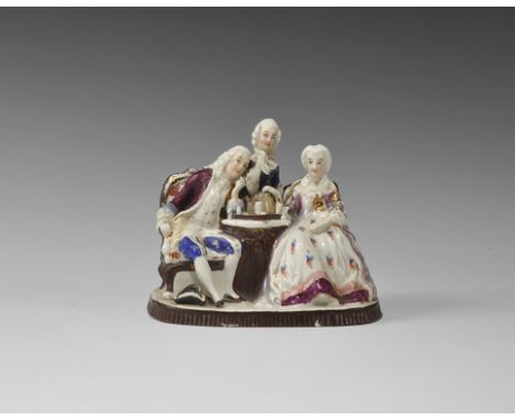 Late 19th-20th century AD. A hollow white-glazed porcelain montage of a seated couple playing chess, accompanied by a young s