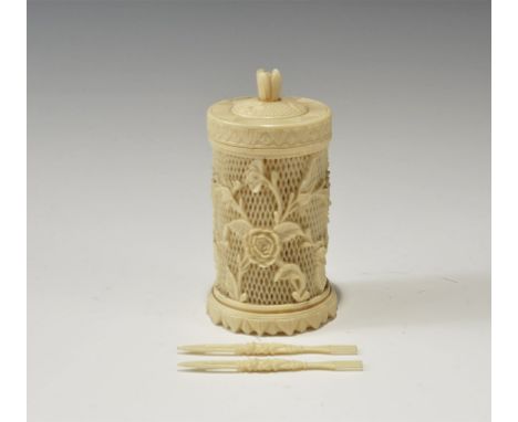 20th century AD. A tubular composition jar with lattice and roses to the body, leaves to the base, lid with rose-bud knop han
