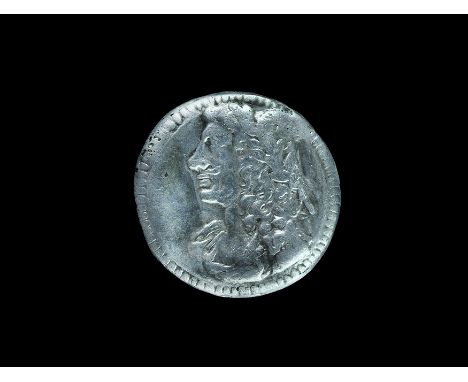 18th century AD. A discoid silver button with beaded border, profile bust of King George; loop to the reverse. 1.15 grams, 15