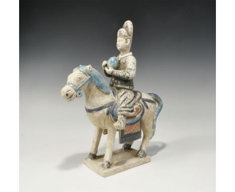 . An undated archaistic glazed ceramic horse and rider figurine in Ming Dynasty, 1368-1644 AD style comprising: a standing ho