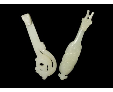 20th century AD. A pair of faux-jade belt fasteners, each with beast-head hook and stud to the reverse. 89 grams total, 14-15