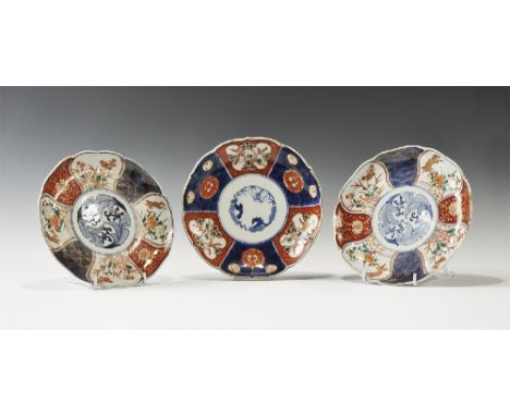 1930-1950 AD. A mixed group of tin-glazed ceramic plates comprising: two matching with central blue motif of leaves and flowe