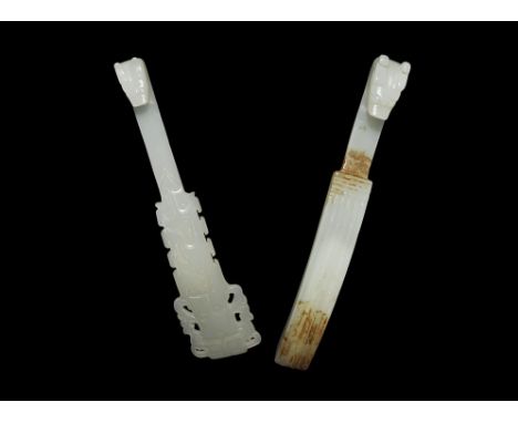 20th century AD. A pair of faux-jade belt fasteners each with a beast-head hook and stud to the reverse. 97 grams total, 15-1