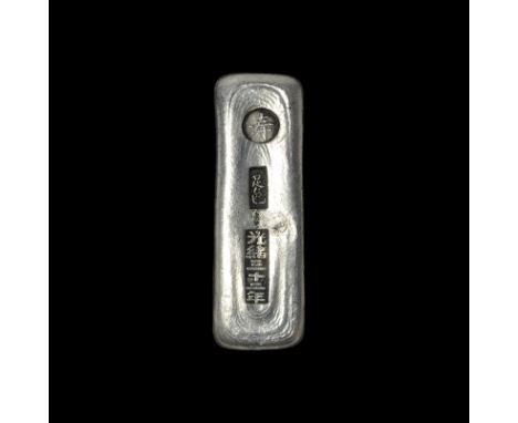 20th century AD. A silver-coloured metal rectangular ingot with stamped impressions to one face. 156 grams, 82mm (3 1/4"). Ac