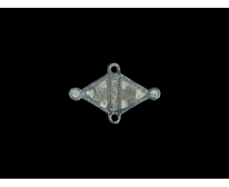 2nd century AD. A flat-section lozengiform plate brooch with two pierced lateral lugs and enamel-filled lugs top and bottom; 