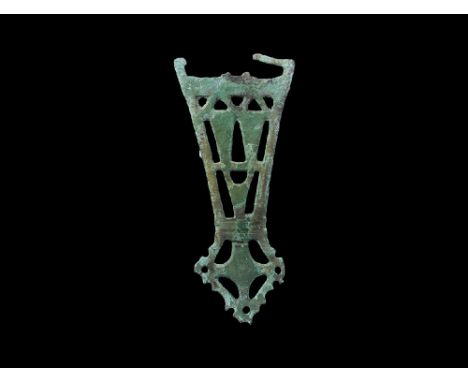 6th-7th century AD. A Slavic flat-section openwork plate brooch with trapezoidal body and lozengiform foot, geometric panels,