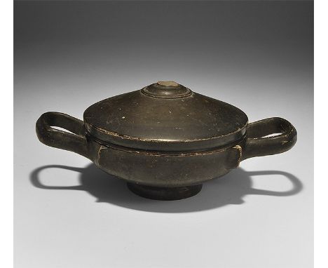 5th-3rd century BC. A ceramic blackware lekanis with basal ring, two loop handles, separate domed lid. 360 grams total, 21cm 