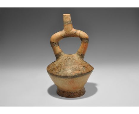 20th century AD. A ceramic stirrup jar with complex painted designs to the upper face and base, including profile busts, bird