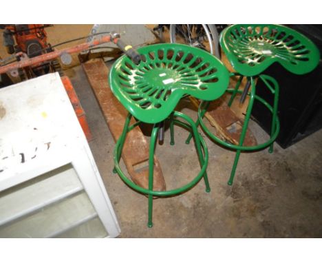 A tractor seat stool (55)