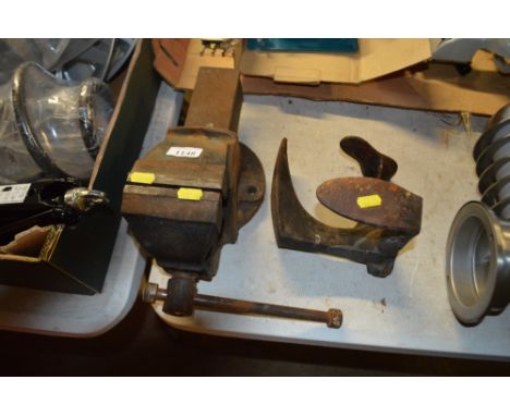 A metal shoe last; together with a bench vice