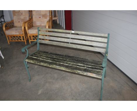 A teak and metal garden bench