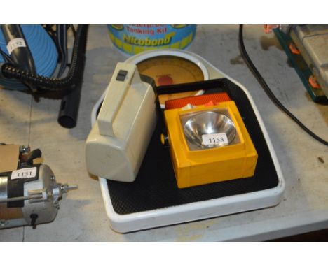 A set of Salter scales and two torches