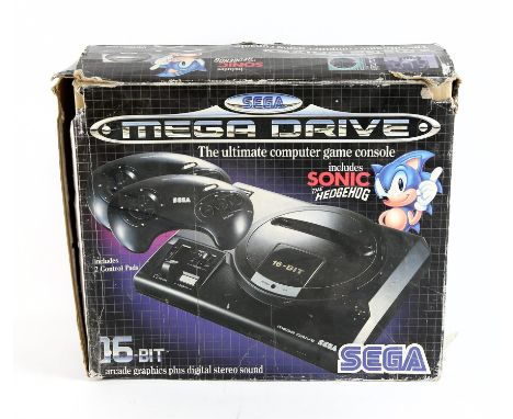 SEGA Mega Drive boxed console w/2 controllers and Master System Converter (PAL) Item is boxed an in used condition The outer 
