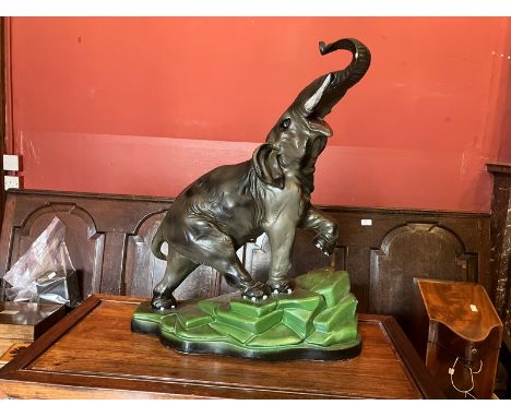 Painted Elephant statue standing 58cms to tip of trunk, cast or possibly finished in plaster&nbsp; &nbsp;Has initials NA 190 