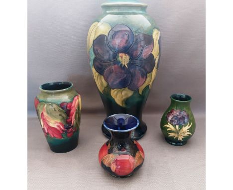 A collection of Moorcroft to include a tall Hibiscus pattern lamp base and 3 smaller vases , various back stamps as shown, 3 