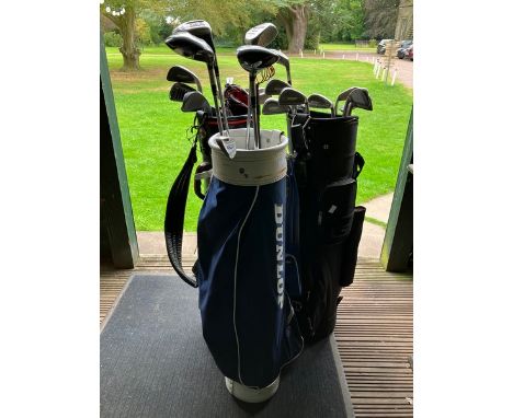 3 carry bags with golf clubs i- 3 bags one Dunlop two unbranded containing 25 assorted clubs in total, Woods. Wedges, Irons, 