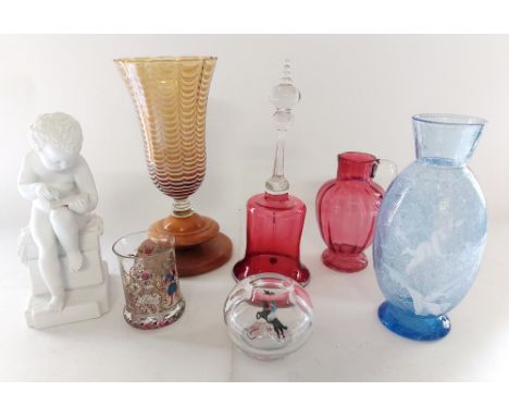 A collection of glass ware to include 2 ruby glass items, the bell is AF, a blue crackle effect Mary Gregory style vase stand