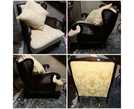 Art deco Bergere style Arm chair, scrolled arms above a double caned side panel with carved detail to front frame&nbsp; and s