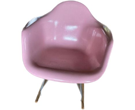 Manner of Charles & Ray Eames fibreglass, chrome and wooden feet pink tub rocking chair, by Modernica, Los Angeles (stamped u