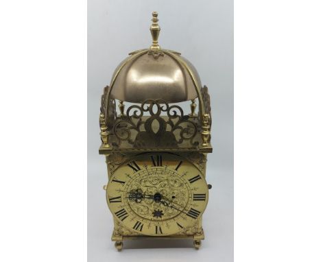 A Eureka electric lantern clock, the 18cm chapter ring stamped no 2217, signed Eureka clock co ltd London, pat no 14614-1906 