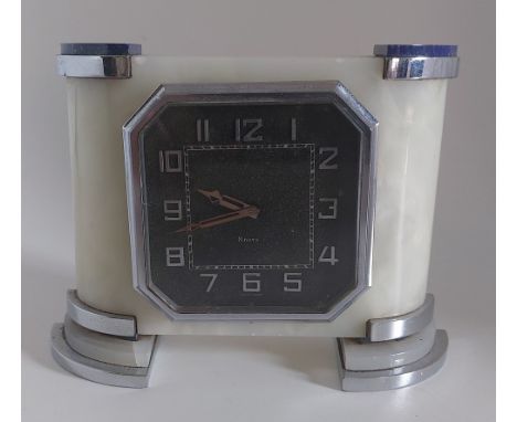 An 8 day Swiss made Lapis Lazuli 1940's Art Deco mantel clock, standing on chrome feet. slight damage to one edge as shown,  