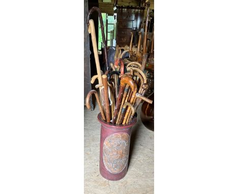 Ceramic Stick stand&nbsp; with decorated plaque detailing fish. contents over 30 sticks, canes and umbrella.&nbsp; Stand meas