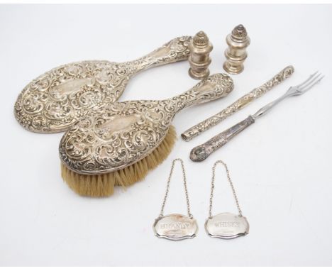 A collection of silver. Comprising an Edwardian weighted hair brush and mirror and the covering for a hair comb; contemporary