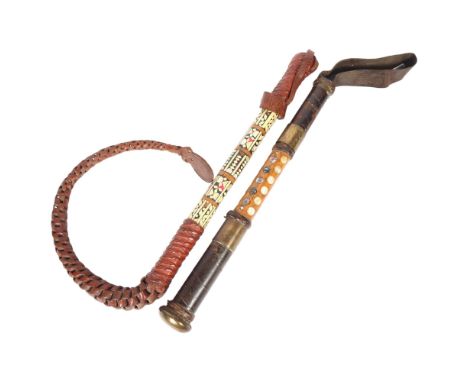 A Palestine Police truncheon, turned wood and leather-mounted, with leather strap handle with brass mounts, the 2 bands readi